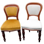 A pair of 19thC mahogany balloon back chairs, each with a padded back and seat, on turned tapering l