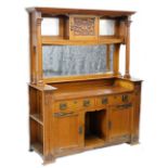 A Victorian Art Nouveau oak mirror back sideboard, the raised back with a moulded cornice above a fl