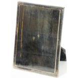 A 20thC photograph frame, of plain rectangular form with ebonised strut support, marked P. PAT25474,