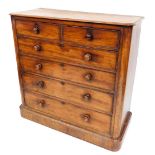 A Victorian mahogany chest, of two short over four long graduated drawers, raised on a plinth base,