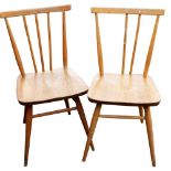 A pair of Ercol ash and elm Windsor chairs, model 391. (AF)