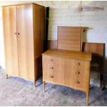 A Heal's of London early 20thC satin walnut dressing suite, comprising a double wardrobe with a pair