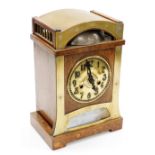 An early 20thC Art Nouveau oak and brass cased mantel clock for Liberty and Co, circular brass dial
