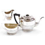 A Victorian silver three piece tea set, comprising teapot with ebonised knop and handle, two handled