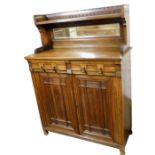 A Victorian Gothic oak and mahogany chiffonier, with a galleried mirror back, with single shelf, ove