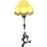 A Victorian brass and cast iron gasolier standard lamp, later converted to electricity, the reservoi