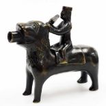 A German Gothic style bronze aquamanile, probably 18th/19thC, modelled as figure mounted on a lion,