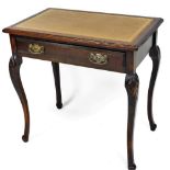 A Victorian oak writing table, the gilt tooled tan leather top above a single frieze drawer, raised