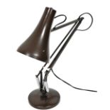 An Anglepoise desk lamp, in brown.