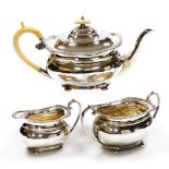 An Edward VII silver three piece tea set, comprising teapot, milk jug and two handled sugar bowl, th
