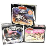 A group of Star Wars boxed toys; Battle Damaged X-Wing Fighter, Rebel Armor Snowspeeder and Darth Va