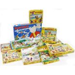 A group of Rupert The Bear puzzles, card games, and Rupert Reveals His Winter Adventure board game.