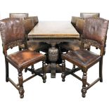 An Elizabethan style oak drawer leaf dining table, raised on leaf carved cup and cover supports unit