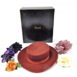 A Christian Dior Diorling lady's wool hat, Alexon fascinator, and silk floral corsage, in a Harrods