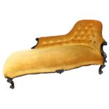 A Victorian mahogany chaise lounge, upholstered in gold button back fabric, 163cm wide.