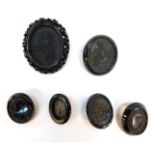 Six Whitby jet frames, to include a Victorian elaborate carved oval frame, 7cm x 5.5cm, a faceted ex