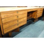 A Robert Heritage design Indian rosewood desk, the rectangular top with a recessed edge above an arr