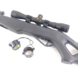 A Gamo Whisper .22 air rifle, with lens, sight, and outer case, 120cm long.