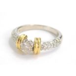 An 18ct yellow and white gold single stone diamond ring, the central stone approx. 0.45 carat, with