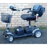 A TGA four wheel mobility scooter, with front basket, charger and key, 93cm high.