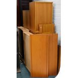 A quantity of Ladderax furniture, comprising of four ebonised metal supports, various teak cabinets,