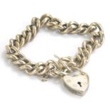 A heavy link silver bracelet, with heart shaped clasp, 16cm long, 1oz.