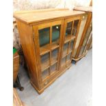 An oak freestanding bookcase.