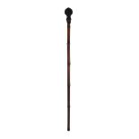 A Victorian bamboo sword stick, the top with cast bronzed figure of Mr Punch, 64cm long.