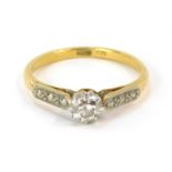 A diamond solitaire ring, with round brilliant cut diamond in claw setting, with etched design plati