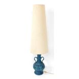 A Western Germany turquoise table lamp, with two handled vase and cream shade, the base 41cm high.