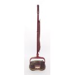 A Hoover vintage vacuum cleaner, model 0212, in maroon bakelite and metal.
