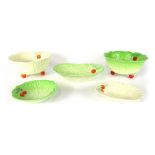 A group of Beswick ware pottery, comprising two green and white leaf cabbage bowls, 12cm high, a whi