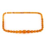 A string of imitation butterscotch amber beads.