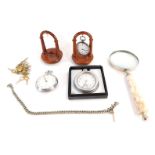 A group of watches and watch stands, comprising a lady's silver pocket watch, white enamel dial and