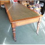 A Victorian mahogany library table, with tooled leather top, moulded frieze, turned legs and brass c