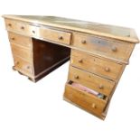 A Victorian oak partner's desk, with combination of drawers and cabinets, in the traditional manner,