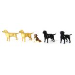Five Beswick dog ornaments, to include light brown Labradors, two black Labradors, and a small dog f
