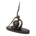 M Leducq. An Art Deco bronzed spelter mantel clock, with gilt over orb on an oval black marble base,