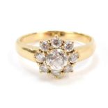 A 9ct gold cluster ring, set with CZ stones, each in claw setting on a plain band, stamped 9k, size
