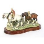 A Border Fine Arts figure group All Creatures Great and Small, JH9, on a wooden plinth base, 36cm wi