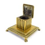 An early 20thC brass inkstand, the square top with ink well slot, lacking interior, on column suppor