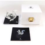 A Swarovski Crystal squirrel ornament, carrying nut, 7cm high, boxed.