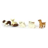 Five Beswick dog ornaments, comprising Chihuahua, Bosun Bulldog, group of Scottie dogs, group of Bul