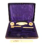 A 19thC ivory manicure set, comprising trinket boxes, brushes, nail buffer, etc, all in fitted case.