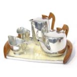 A mid century Picquot ware tea service, comprising tea pot, milk jug, sugar bowl, hot water pot and