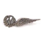 An Elizabeth II silver navigator wing brooch, the wreath with central N emblem and single wing,