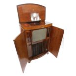 A rare walnut cased Decca Model 300 Television Radio Gram retailed by Harrod's, the doors opening to