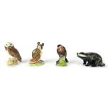 Four Beswick animal ornaments, comprising badger, owl, mouse with berry, and a goldfinch, tallest 9c