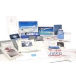 A group of Concorde memorabilia, luggage tags, Concorde plane, souvenir booklets, hand towels, etc.