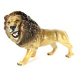 A Beswick Lion, standing in roaring pose, with black Beswick England stamped to underside, 15cm high